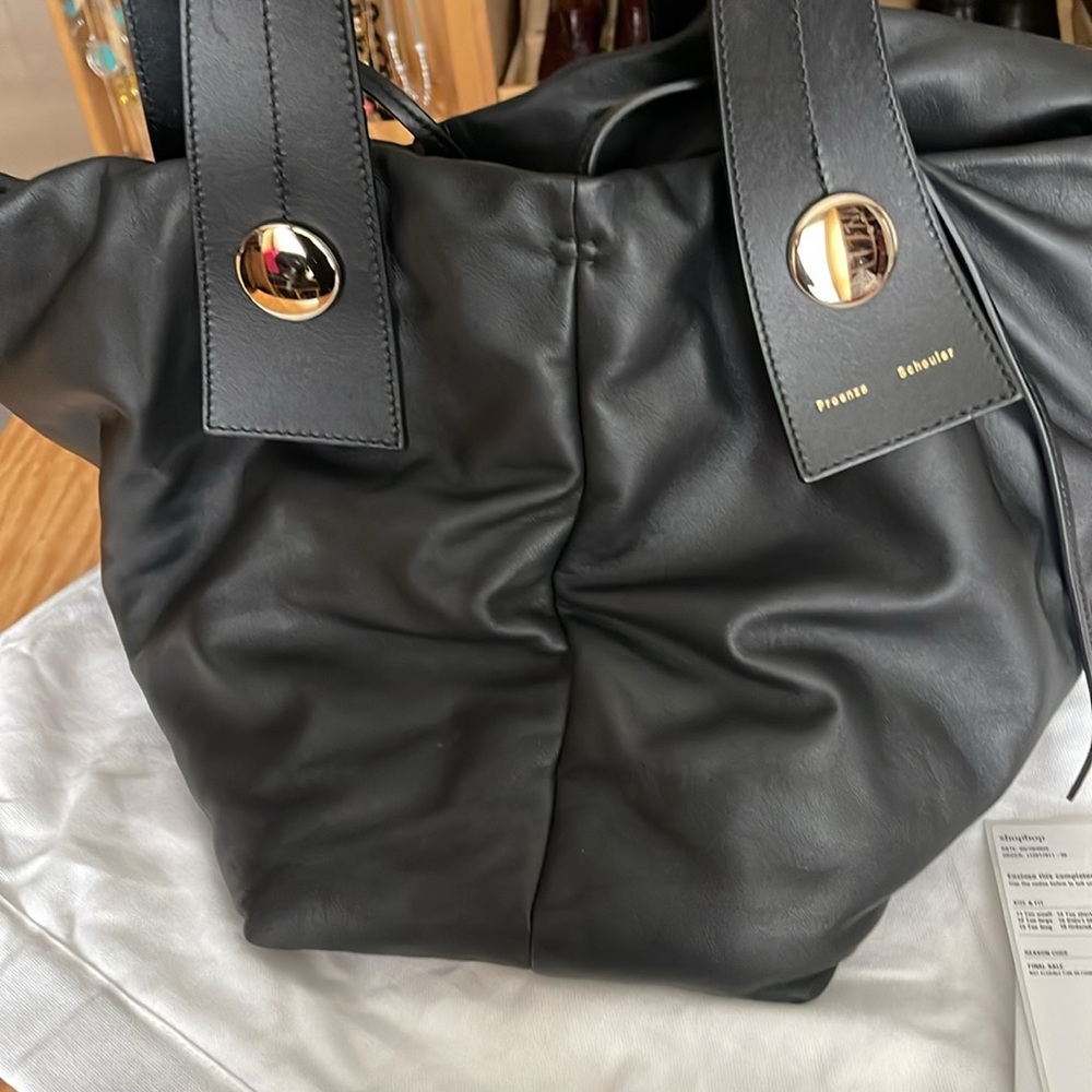 Proenza black puffy Tobo used once. Lining is stained with some pen marks